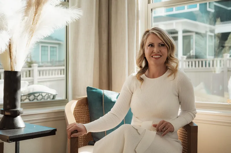 Brandy Unruh, REALTOR® with Compass, Erie, Colorado, in a sunlit living room