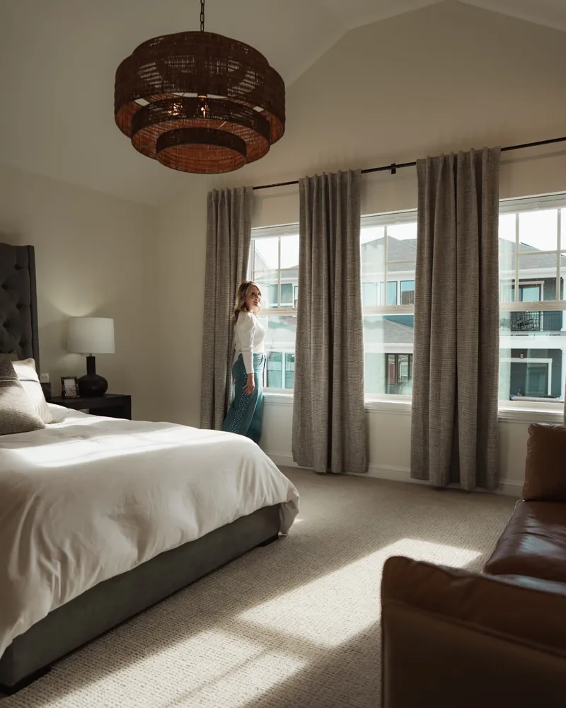 Brandy Unruh, REALTOR® with Compass, Erie, Colorado, in a staged bedroom in Erie, CO