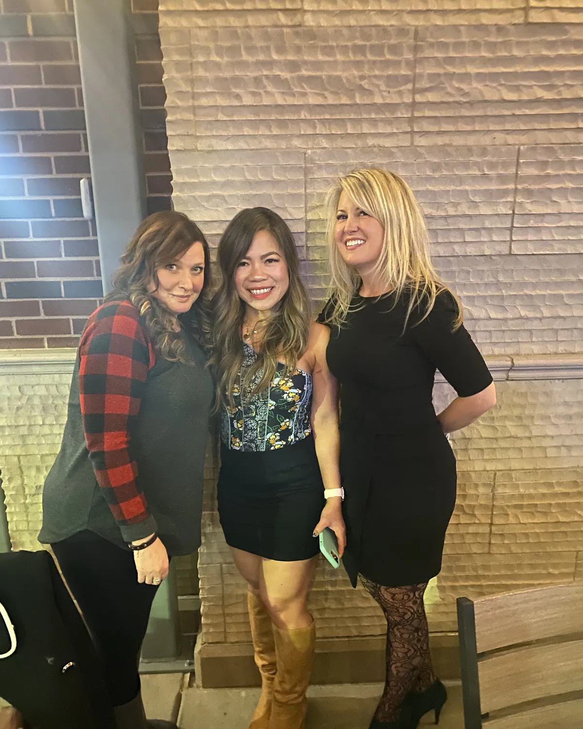 Brandy Unruh, REALTOR® with Compass, celebrating with clients on the Colorado Front Range