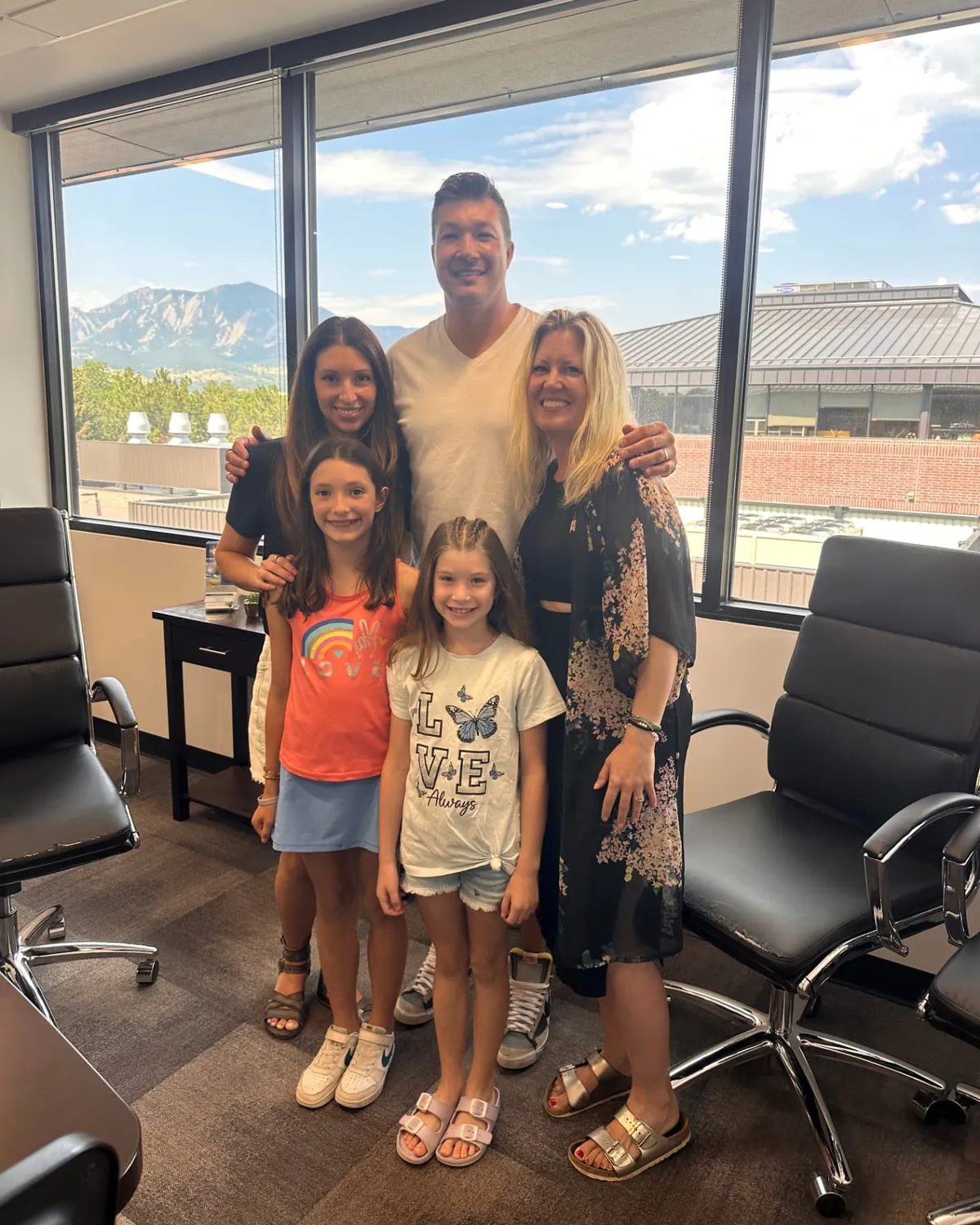Brandy Unruh, REALTOR® with Compass, celebrating a closing day with a family in Colorado