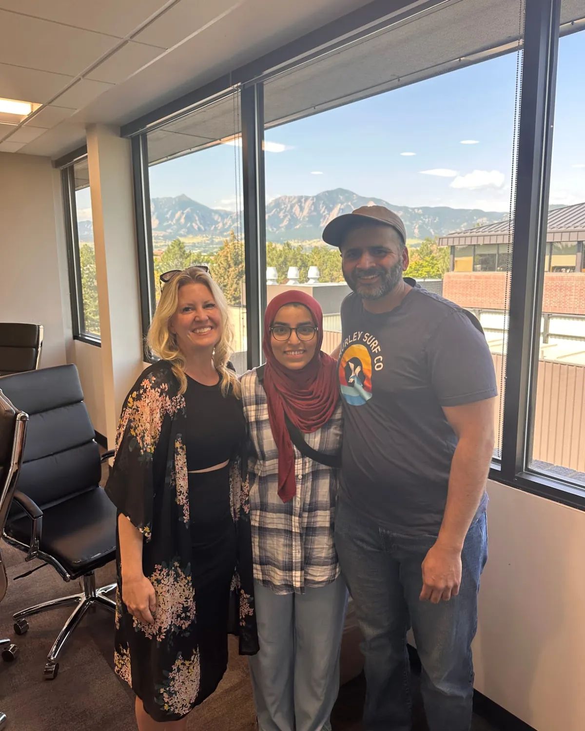 Brandy Unruh, REALTOR® with Compass, with clients after a closing on the Colorado Front Range