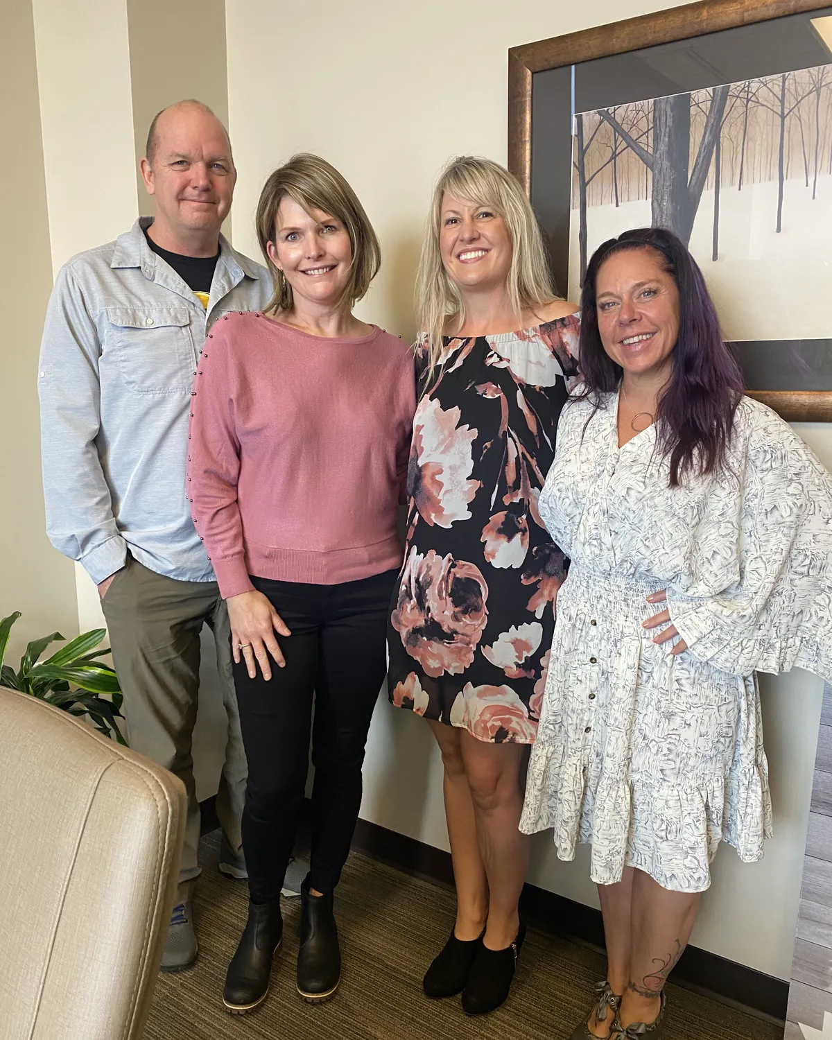 Brandy Unruh, REALTOR® with Compass, with a group of clients after closing in Colorado